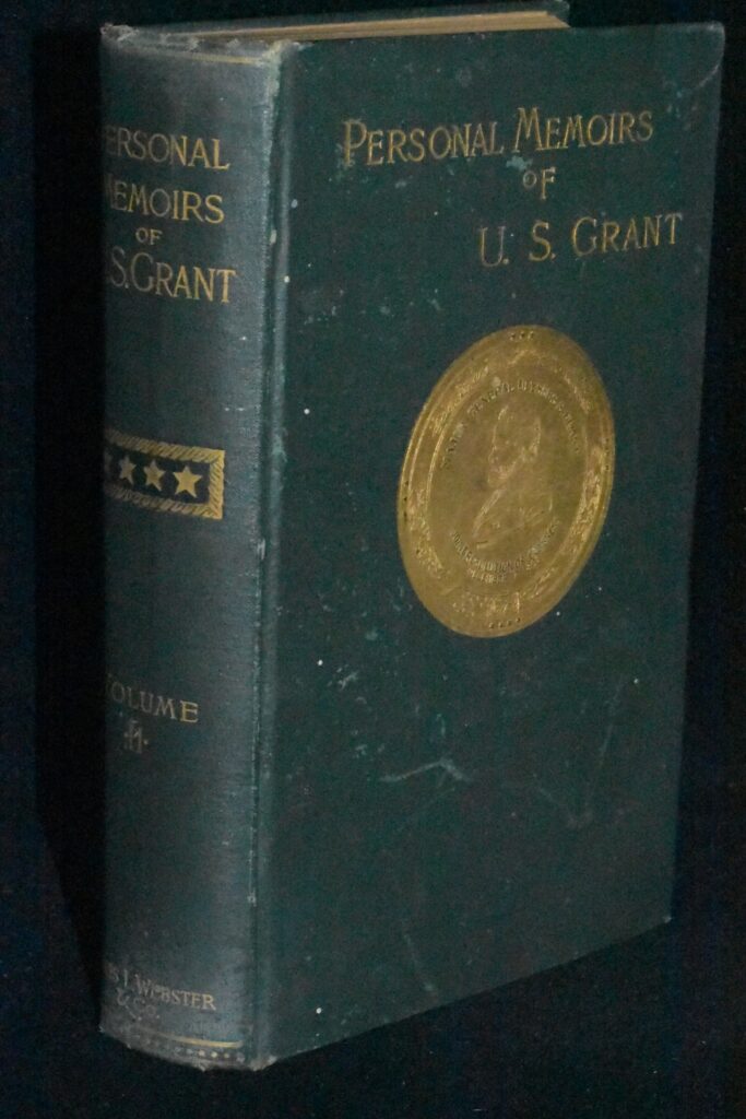 Green, clothbound copy of "Personal Memoirs of U.S. Grant" with bright gilt lettering on the spine and front board.